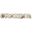 A personalised sympathy tribute shows the word "GRANDPA" laid out in a long horizontal line, crafted entirely from lush white chrysanthemums that form thick, three-dimensional block letters. The chrysanthemums are arranged so closely that they create a soft, quilted surface, giving each letter a comforting, pillow-like appearance against the clean white backdrop. Subtle bands of light lavender ribbon frame the base of the letters, peeping out beneath the flowers to add a gentle hint of pastel purple and to outline the shapes with a delicate touch of colour. Behind the blooms, dark green bars link the letters and provide support, but they remain mostly hidden so the word itself stands out clearly. Carefully designed floral sprays break the expanse of white: the 'G' on the left and the central 'D' are adorned with deep red anthuriums, their glossy, heart-shaped blooms and golden spadices resting among dark green foliage and tiny sprigs of purple, adding depth and emotion. The first and final 'A' each carry a cluster of soft yellow-green orchids with intricate centres and graceful petals, set into fresh leaves that bring an air of quiet sophistication. This is the sort of tribute a Shacklewell family might choose for a funeral at a local chapel or crematorium near Kingsland Road, where they want to honour a beloved grandfather by name. The atmosphere is one of calm dignity and tenderness, a floral memorial that conveys love, respect, and cherished memories through its careful craftsmanship and serene palette.